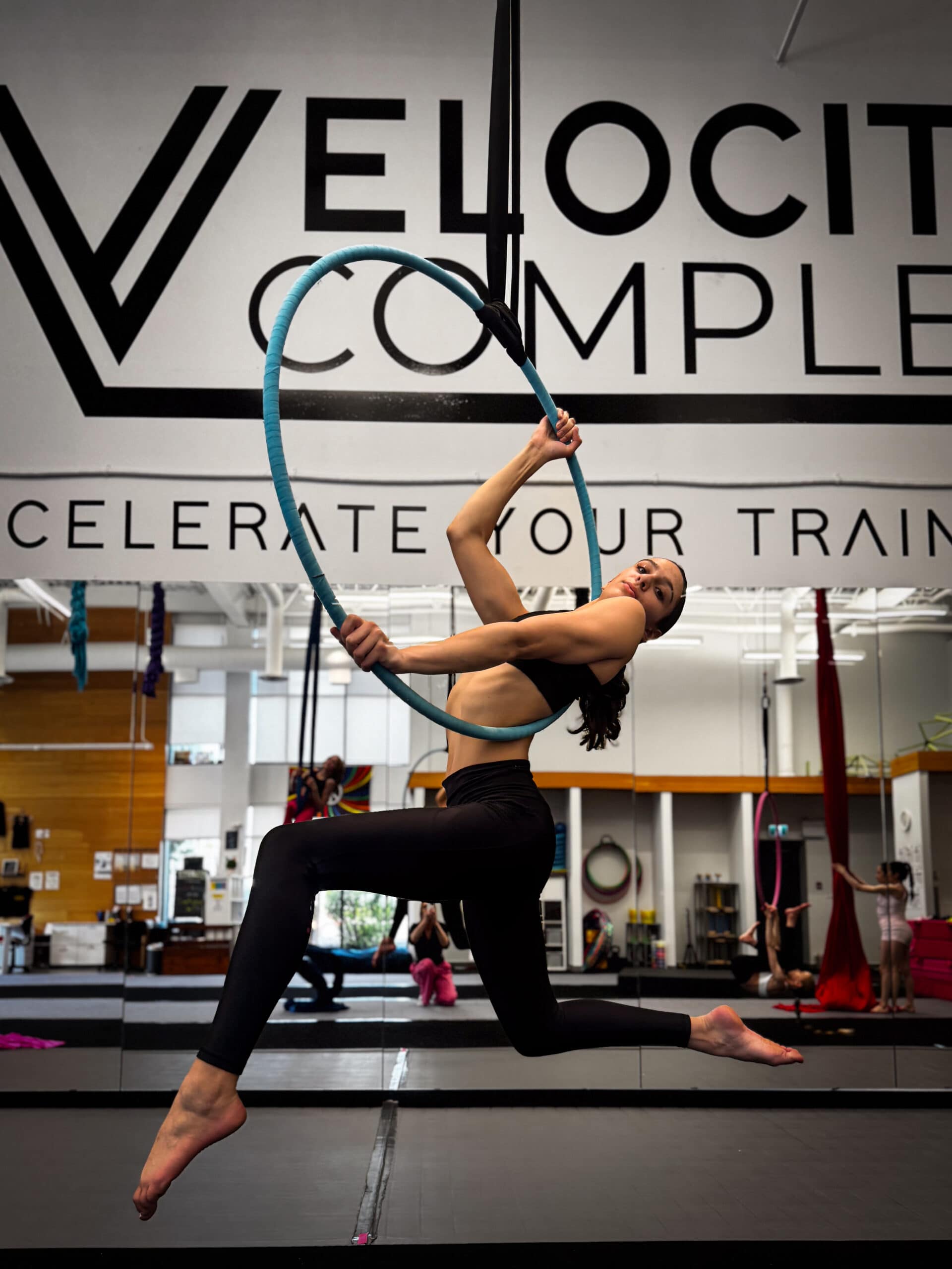Aerialist on aerial hoop lyra